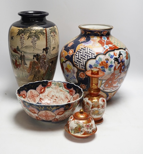 Japanese Kutani, Satsuma and Imari; four vases, a bowl, a pair of candlesticks and a pot (8). Condition - candle sticks damaged